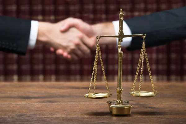 depositphotos_97931694-stock-photo-justice-scale-on-table-with